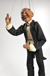 A puppet of an older gentleman.